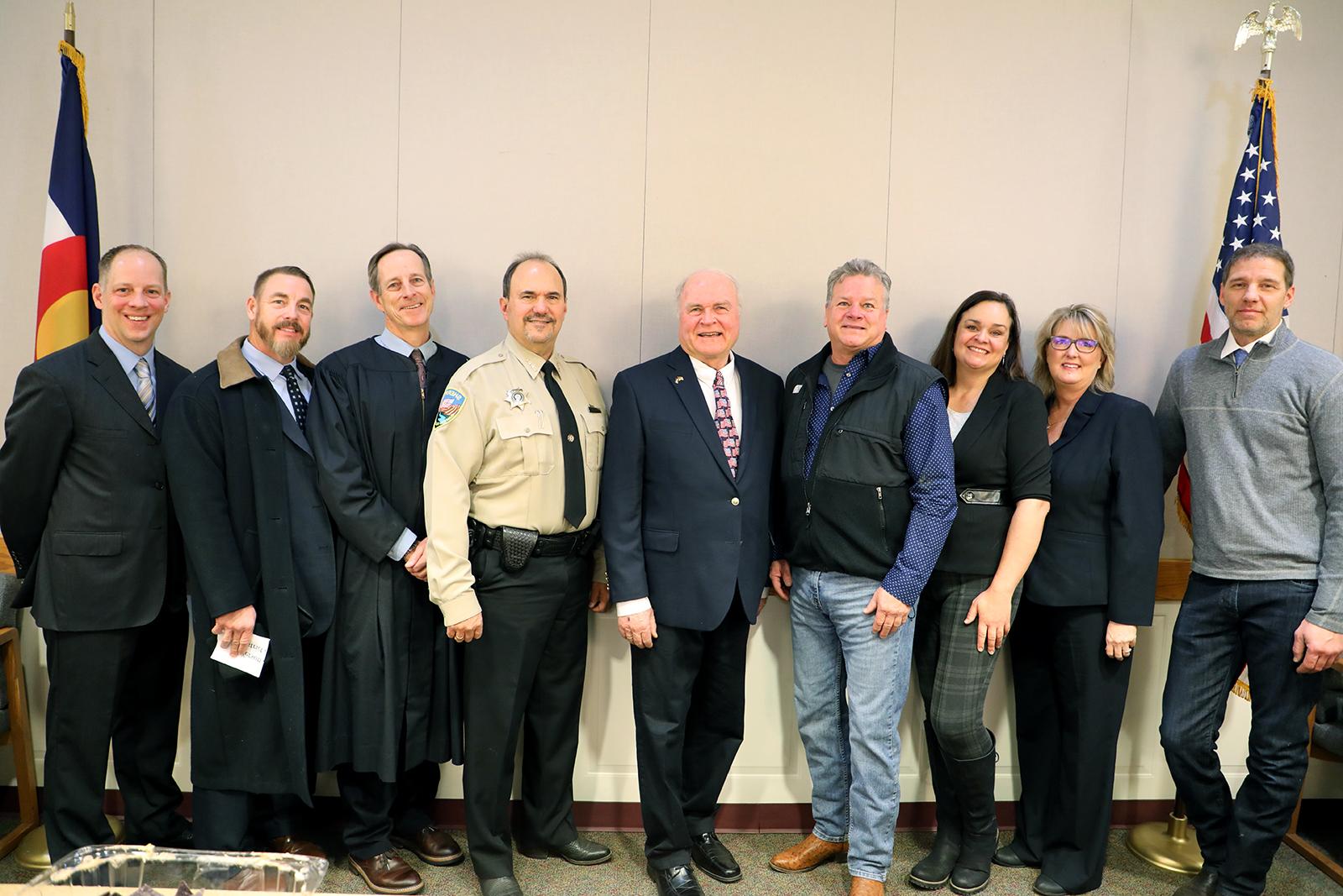 Garfield County's elected officials pose with Ninth Judicial District Judge John Neiley. Shown are Garfield County Assessor Jim Yellico, Clerk and Recorder Jackie Harmon, Treasurer Carrie Couey, Surveyor Scott Aibner, District 1 Commissioner Tom Jankovsky, Sheriff Lou Vallario, Judge Neiley, District Attorney Jeff Cheney, and Coroner Rob Glassmire.